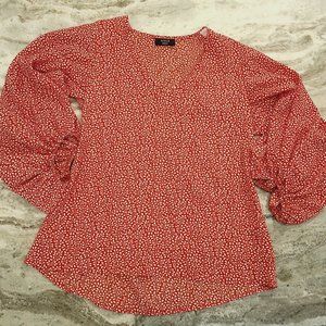 White floral pattern against Red-   Long sleeve blouse